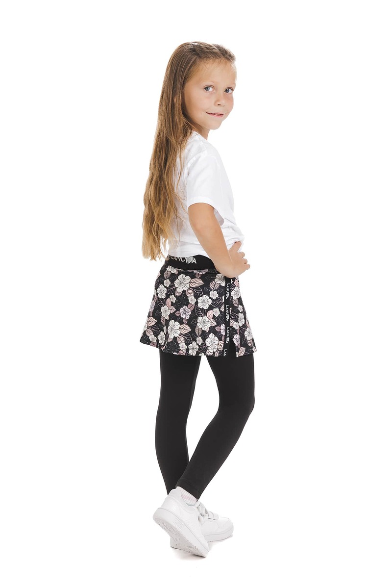Skort Carita kids – krilo z dolgimi všitimi pajkicami s cvetličnim vzorcem v črni, beli in nežno roza barvi