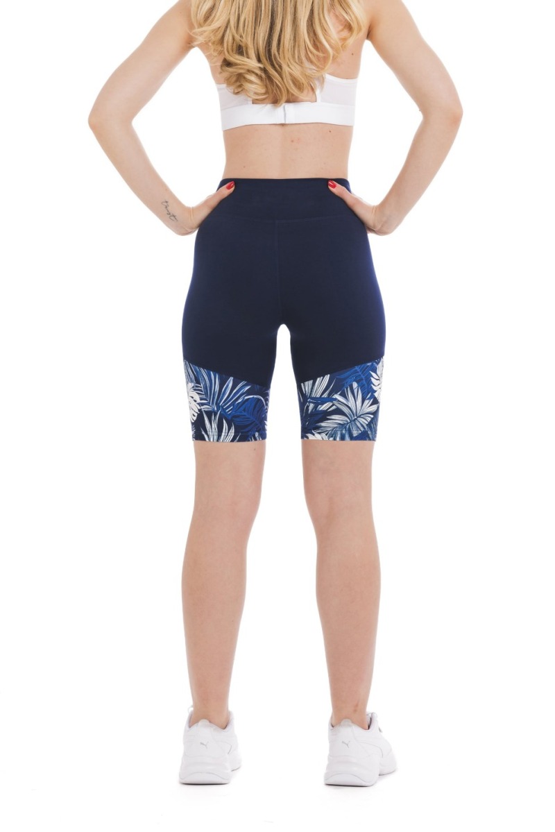 Temno modre kratke pajkice Passio s tropskim listnim vzorcem v beli in modri barvi na spodnjem delu hlačnic