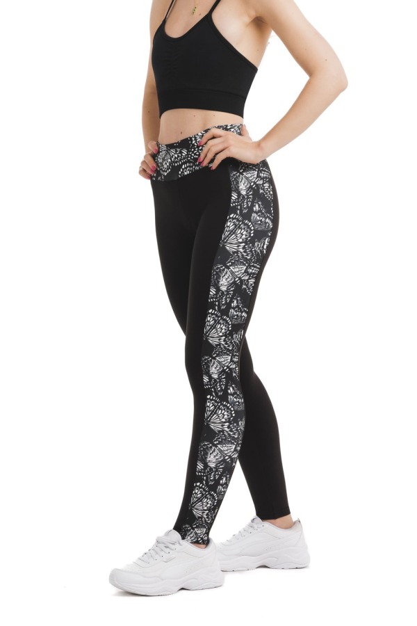 Črne dolge pajkice z abstraktnim vzorcem metuljem v beli barvi ob straneh hlačnic in na pasu Črne dolge pajkice z abstraktnim vzorcem metuljem v beli barvi ob straneh hlačnic in na pasu