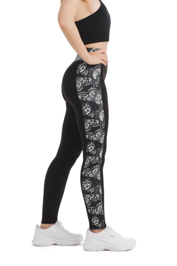 Črne dolge pajkice z abstraktnim vzorcem metuljem v beli barvi ob straneh hlačnic in na pasu Črne dolge pajkice z abstraktnim vzorcem metuljem v beli barvi ob straneh hlačnic in na pasu